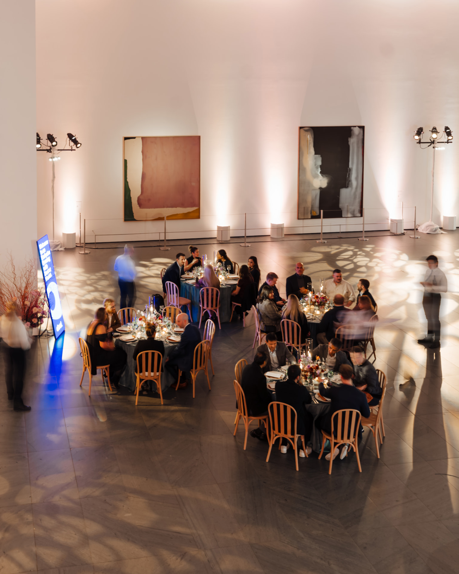 Guests dining beneath large-scale paintings in the MoMA galleries